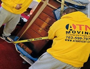 ATN Moving team safely handling large furniture